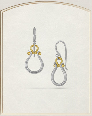 A pair of silver and gold drop earrings with a double-loop teardrop design and a small gold loop at the top, shown on a textured cream background with a light beige arched border.